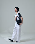 Model holding Zanpu bucket bag in black, by Yaccomaricard, elegant japanese design.