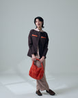 Zanpu bucket bag in dark orange by Yaccomaricard easy to carry and lightwear