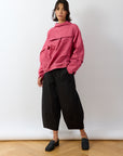Model wearing Shibo Top in Dust Rose by Yaccomaricard, an outfit that feels as comfortable as it looks considered, offering a modern, flattering fit.