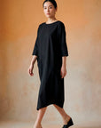Yaccomaricard pocket dress front view with relaxed oversized silhouette.