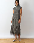 Ash Kazari Skirt angled view showing structured panels and feminine drape.