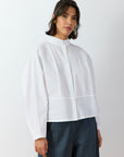 Front view of Bibbu Shirt in white by Yaccomaricard London, oversized cotton lawn shirt with pintuck panel detailing.