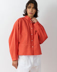 Front view of Bibbu Shirt in poppy red by Yaccomaricard London, oversized cotton lawn shirt with pintuck detailing