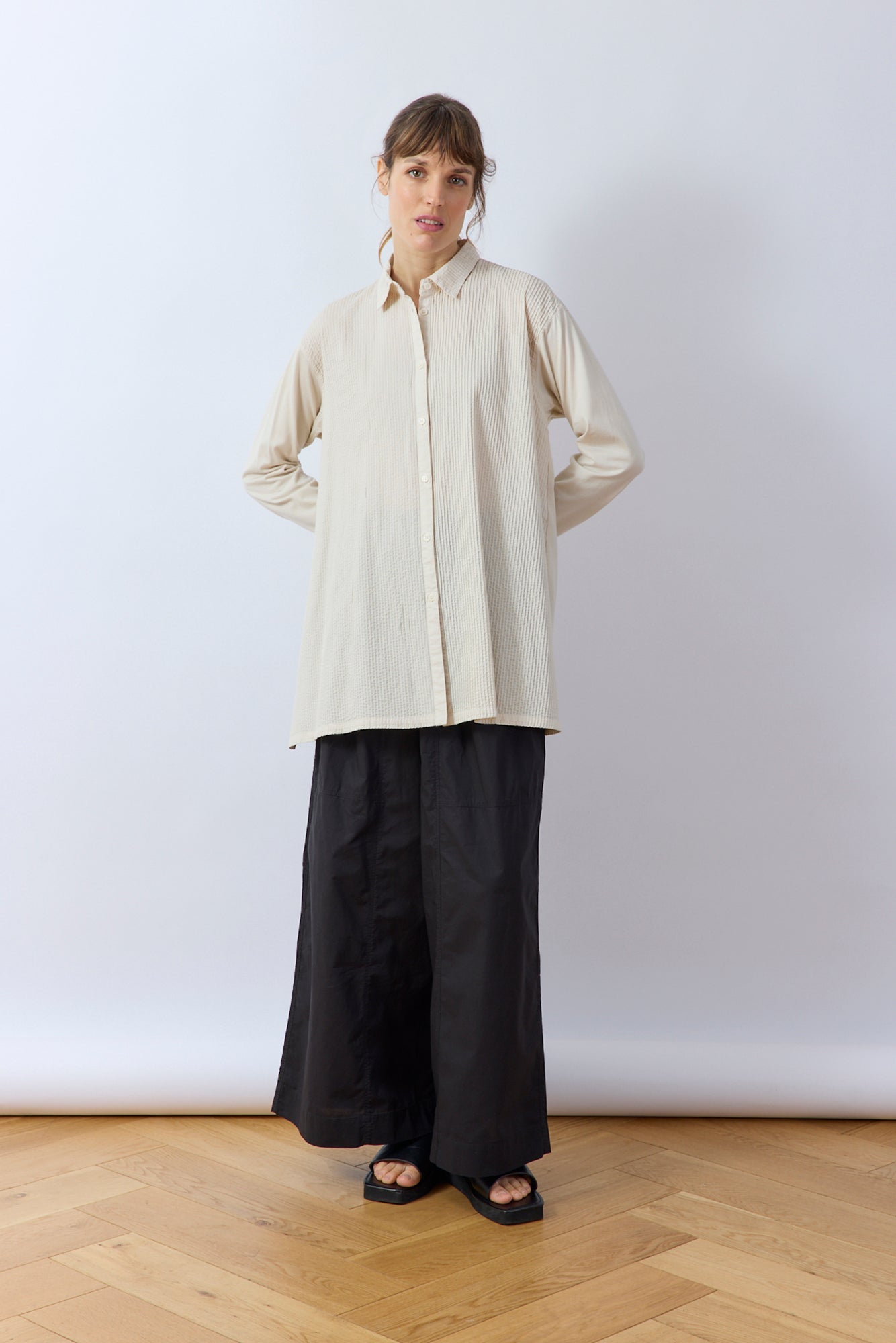 Model wearing Yaccomaricard longline Cotton Jersey Overshirt in Jasmine White – Relaxed Japanese designer styling.