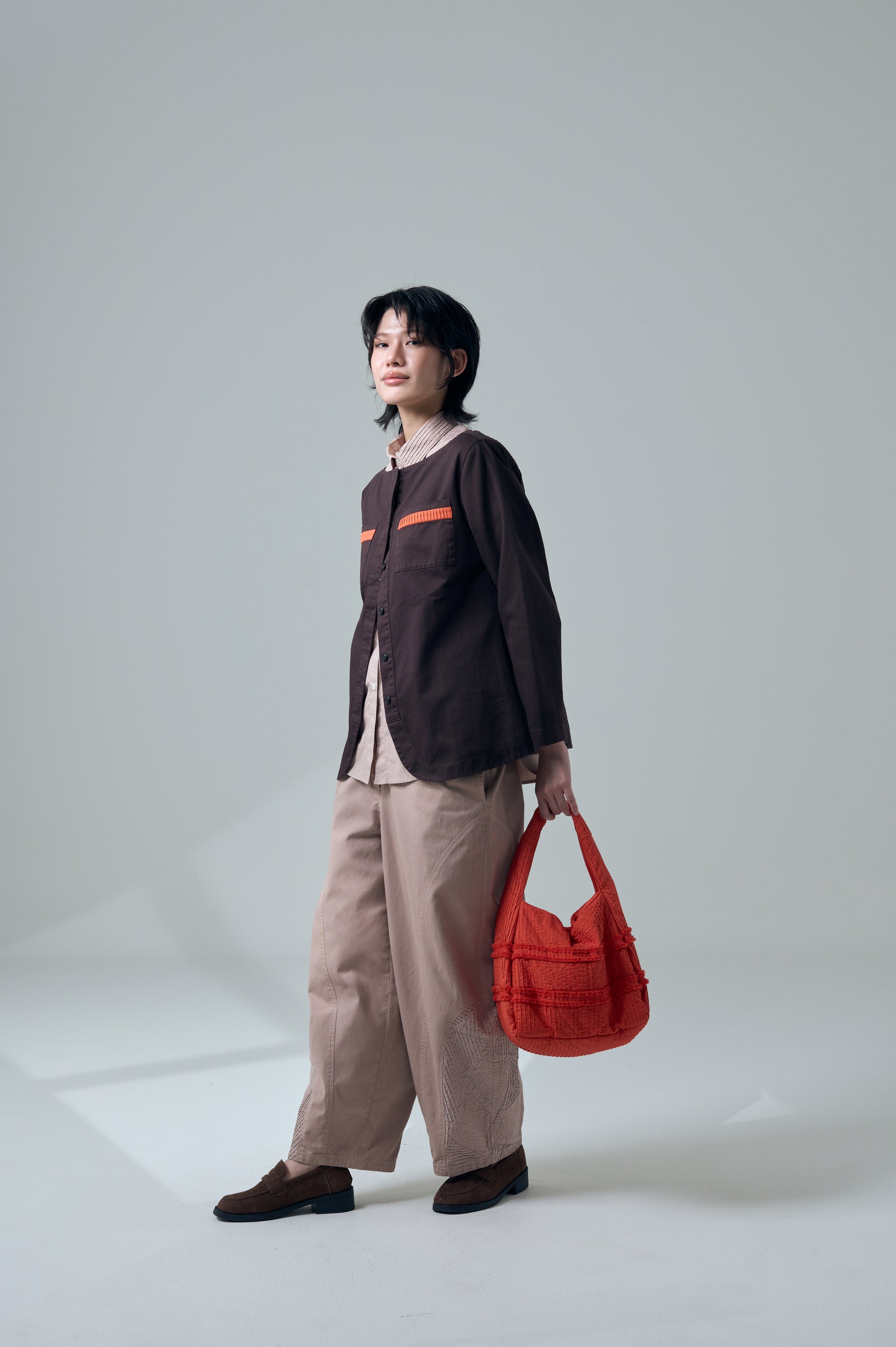 Zanpu bucket bag in dark orange by Yaccomaricard, repurposing leftover fabrics from Yaccomaricard’s own manufacturing process